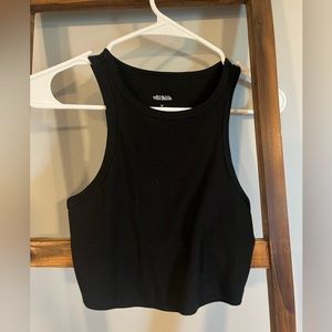 Good basic cropped tank! Pretty cropped but very cute! Tight stretchy material!